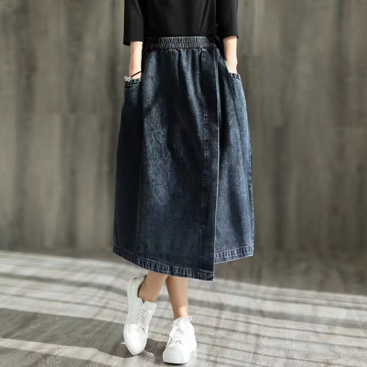 Asymmetric denim skirt with rubber