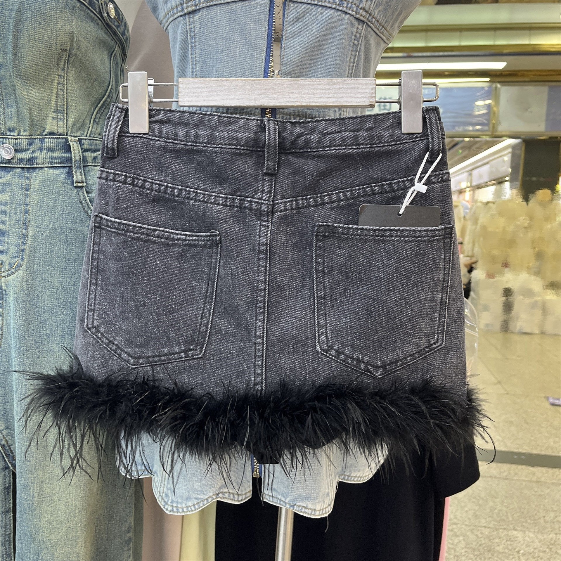 Feather-trimmed mini denim skirt