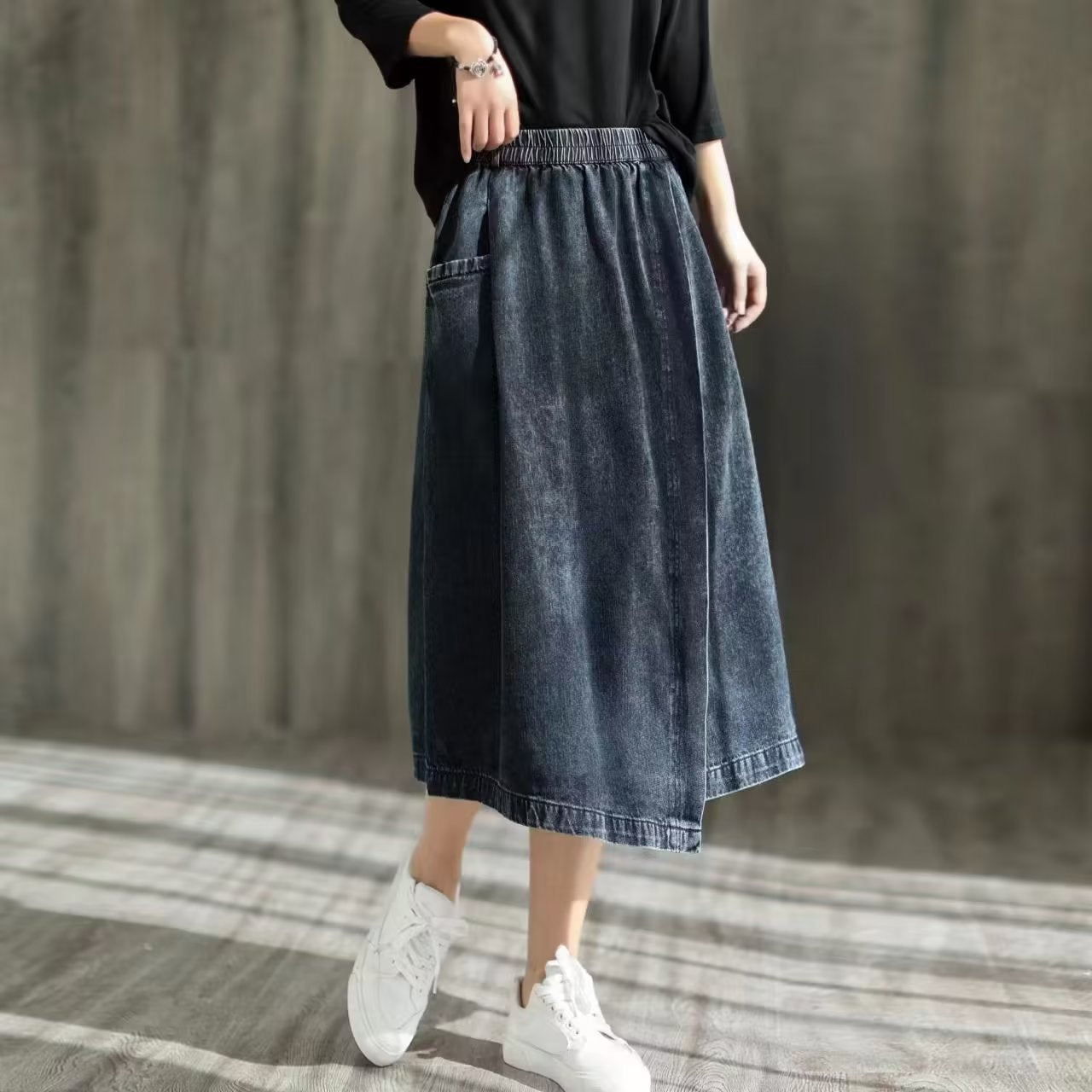 Asymmetric denim skirt with rubber