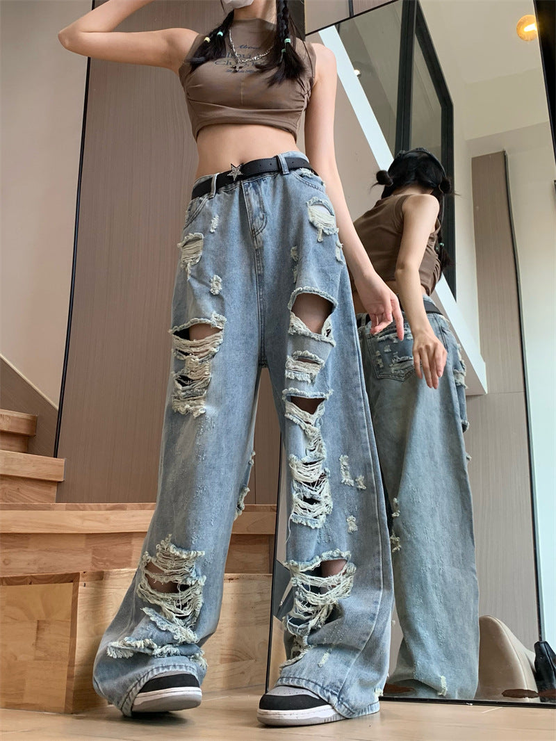 Blaue zerrissene Jeans mit ausgefranstem Punk-Detail und hoher Taille