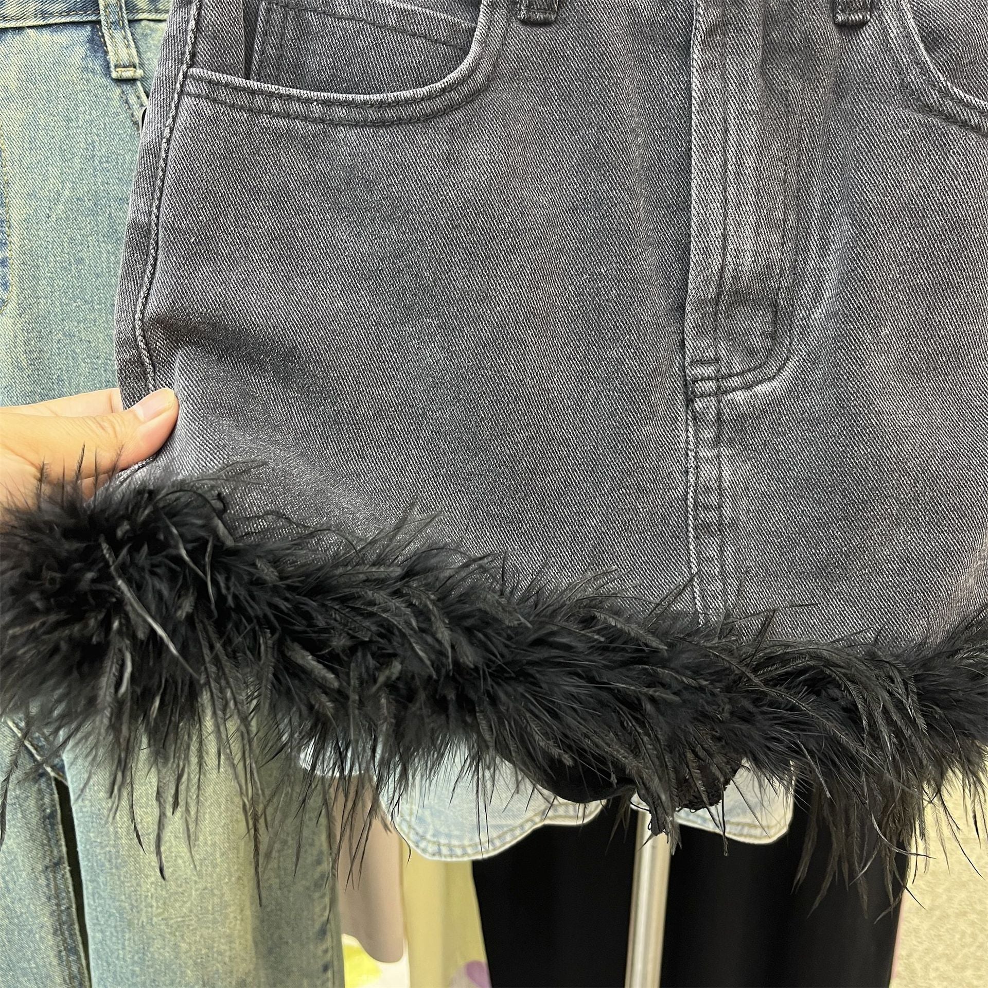 Feather-trimmed mini denim skirt