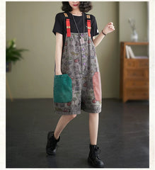 Moderner Jumpsuit aus Denim mit weitem Bein und Schlitzausschnitt, Druckknöpfen