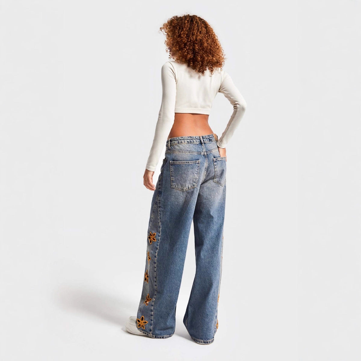 Embroidered high-waisted denim trousers
