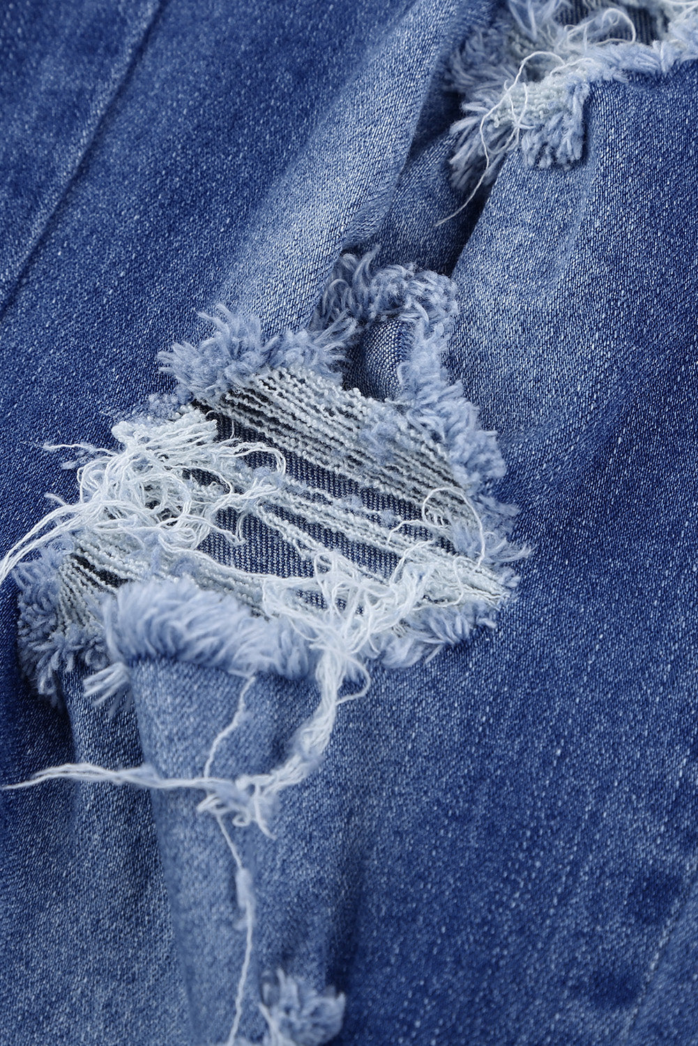 Pantalones deportivos de mezclilla desgastada con bolsillos azules