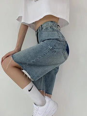 Shorts vaqueros con dobladillo sin rematar hasta la rodilla