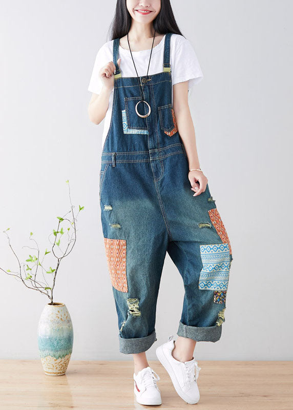 Art Blue Patchwork-Jumpsuit aus zerrissenem Denim mit Taschen