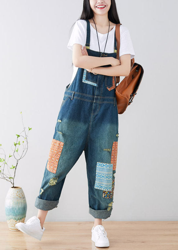 Art Blue Patchwork-Jumpsuit aus zerrissenem Denim mit Taschen