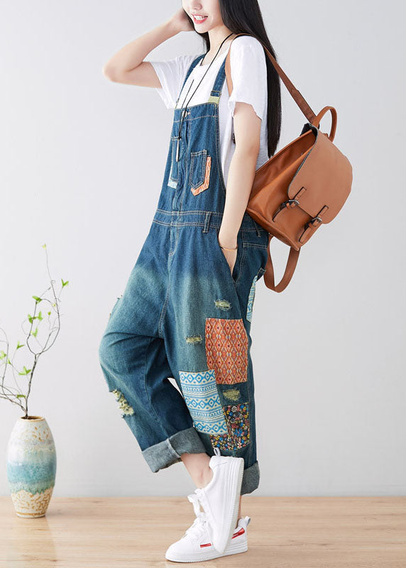 Art Blue Patchwork-Jumpsuit aus zerrissenem Denim mit Taschen