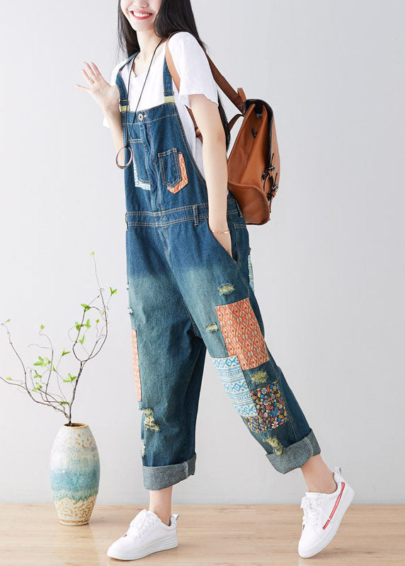 Art Blue Patchwork-Jumpsuit aus zerrissenem Denim mit Taschen