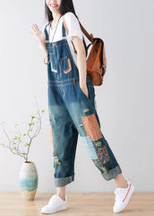 Art Blue Patchwork-Jumpsuit aus zerrissenem Denim mit Taschen