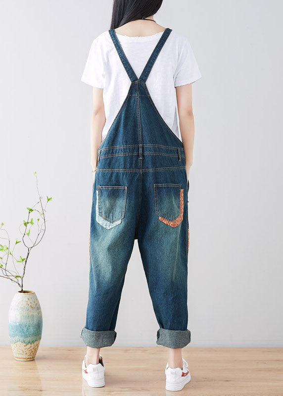 Art Blue Patchwork-Jumpsuit aus zerrissenem Denim mit Taschen