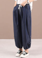 Hermosos pantalones harén de mezclilla con bolsillos azules