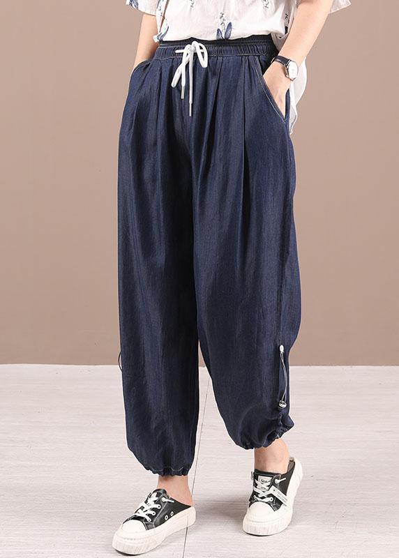 Hermosos pantalones harén de mezclilla con bolsillos azules