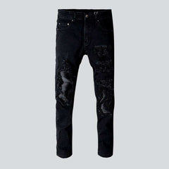 Schwarze Stretch-Bikerjeans mit Patch