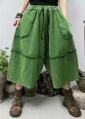 Pantalones cortos vaqueros con cintura elástica y bolsillos verdes estilo bohemio