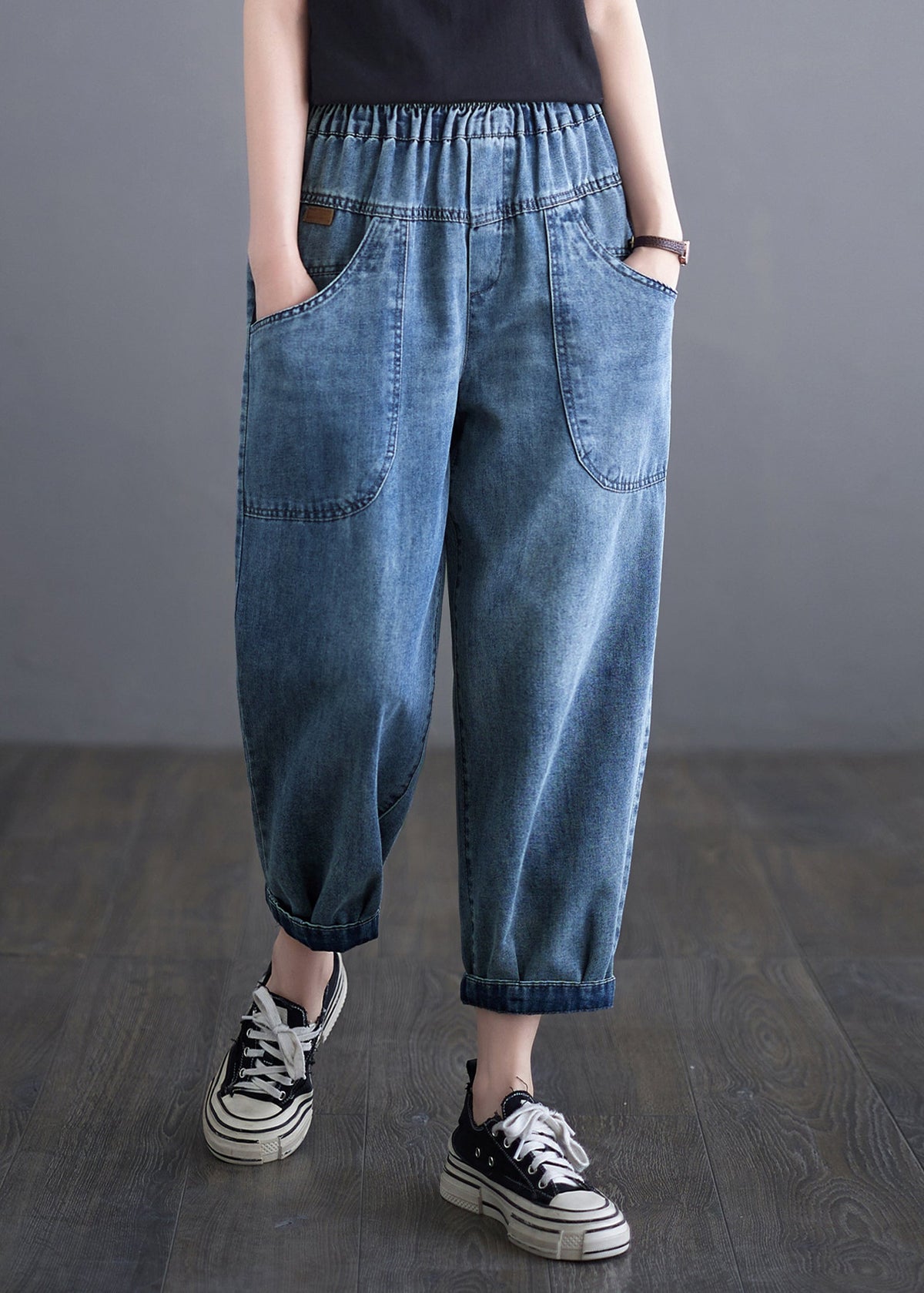 Pantalones harén de mezclilla con bolsillos y cintura elástica azul informal