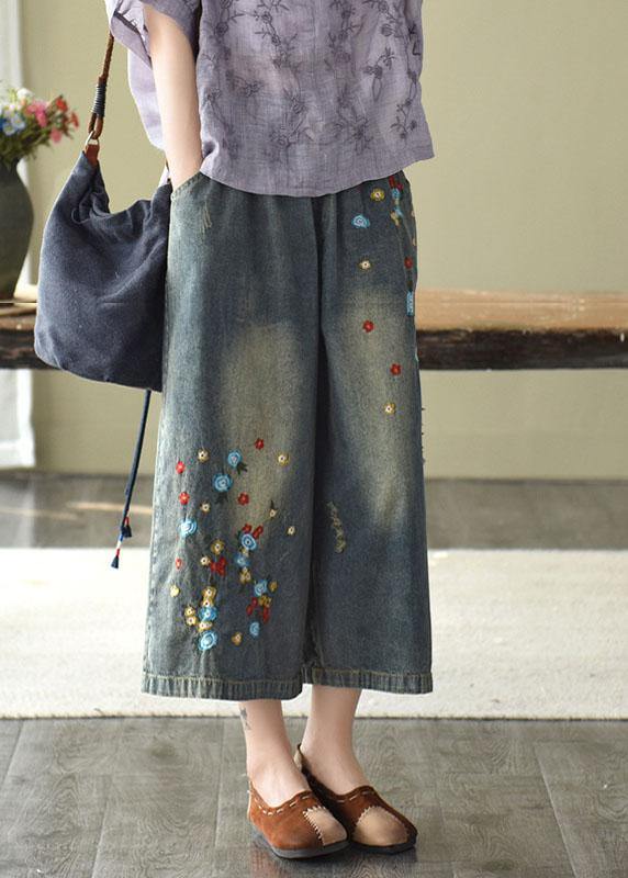 Pantalones vaqueros anchos con agujeros y bordados en color oscuro, cómodos