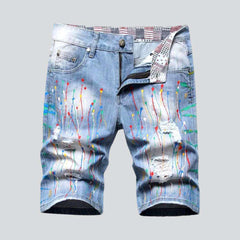 Denim shorts with paint splatters