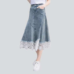 Denim skirt decorated with lace