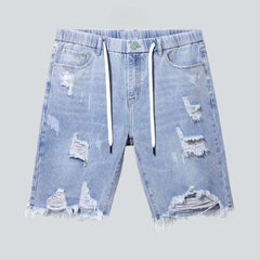 Distressed denim shorts with drawstrings