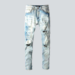 Distressed embroidered jeans for men