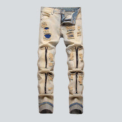 Distressed men jeans with zippers