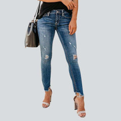 Distressed women skinny jeans