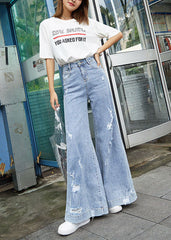 Pantalones elegantes de mezclilla azul de cintura alta con bolsillos y agujeros de algodón y pierna ancha