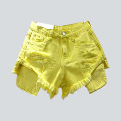 Shorts vaqueros desgastados con bolsillos expuestos