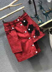 Roter asymmetrischer Jeansrock mit hoher Taille und Patchwork-Knopf