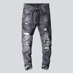 Graue Herrenjeans im Used-Look