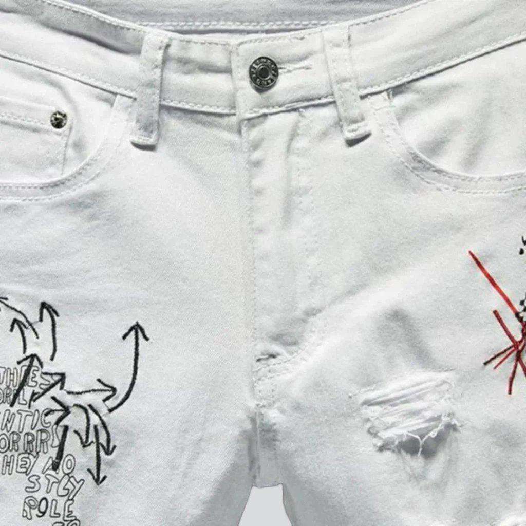 Destroyed painted men jeans