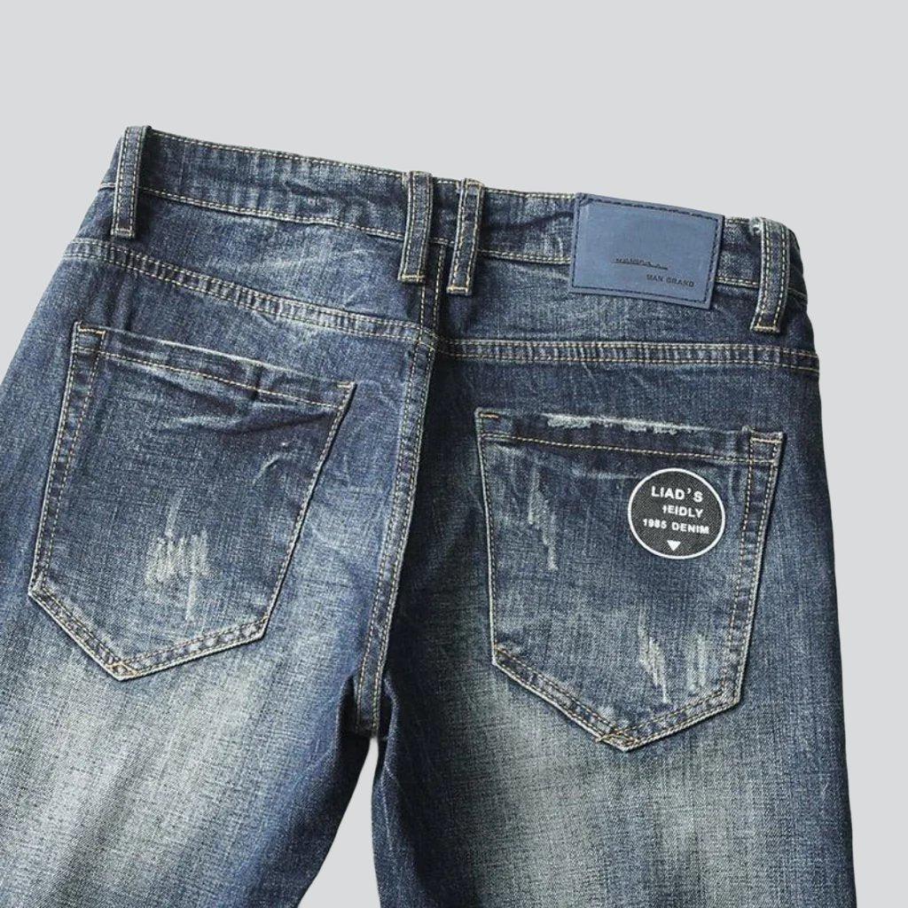 Vintage-Jeans für Herren mit bedruckten Taschen