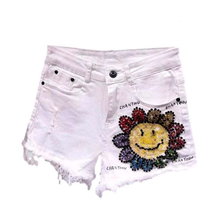 Shorts vaqueros desgastados con flores de cristal