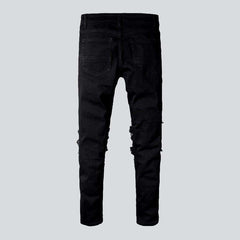 Schwarze Skinny-Bikerjeans mit Patch