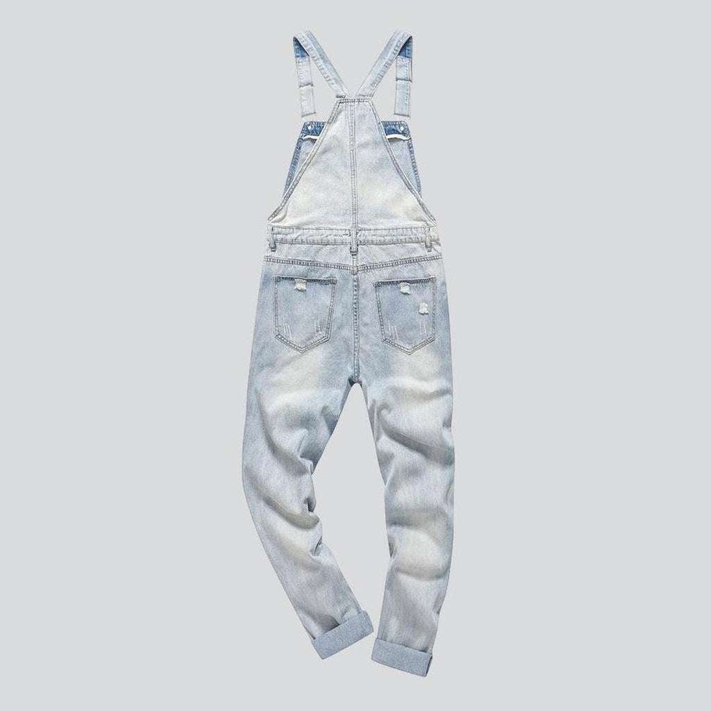 Light blue ripped denim jumpsuit