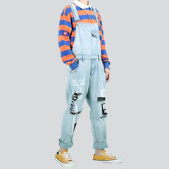 Ripped-leg painted denim jumpsuit