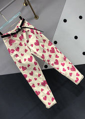 Pantalones vaqueros de patchwork con bolsillos y estampado de corazones y rosas italianas para otoño