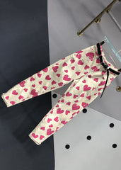 Pantalones vaqueros de patchwork con bolsillos y estampado de corazones y rosas italianas para otoño