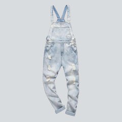 Light blue ripped denim jumpsuit