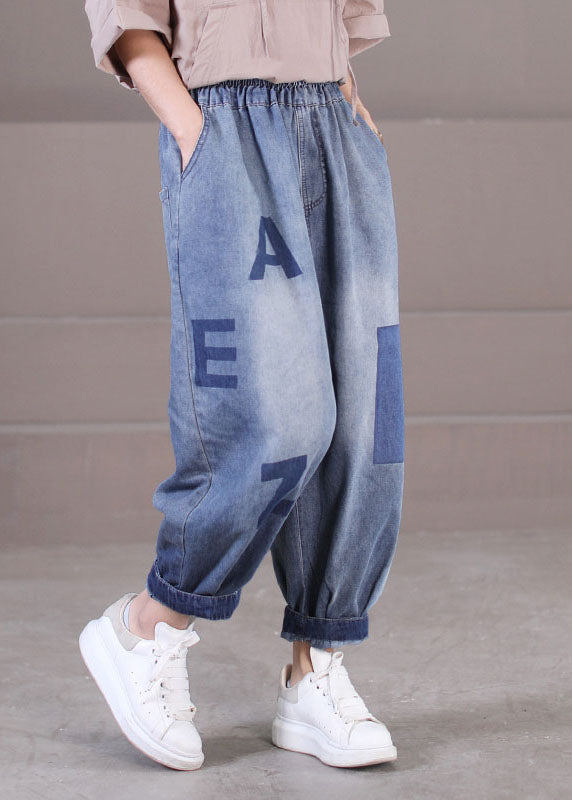 Lockere blaue Haremshose aus Baumwolldenim mit elastischen Taillentaschen und Buchstabendruck