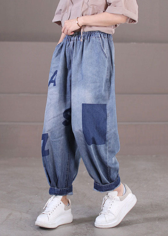 Lockere blaue Haremshose aus Baumwolldenim mit elastischen Taillentaschen und Buchstabendruck