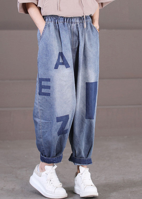 Lockere blaue Haremshose aus Baumwolldenim mit elastischen Taillentaschen und Buchstabendruck