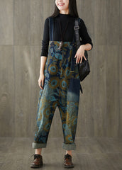 Lockerer, blauer Denim-Jumpsuit mit weitem Bein und Patchwork-Print