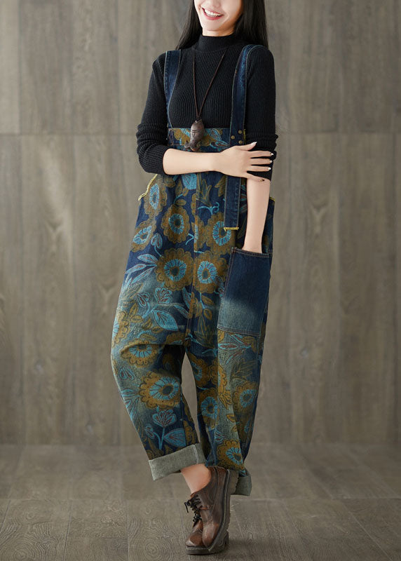 Lockerer, blauer Denim-Jumpsuit mit weitem Bein und Patchwork-Print