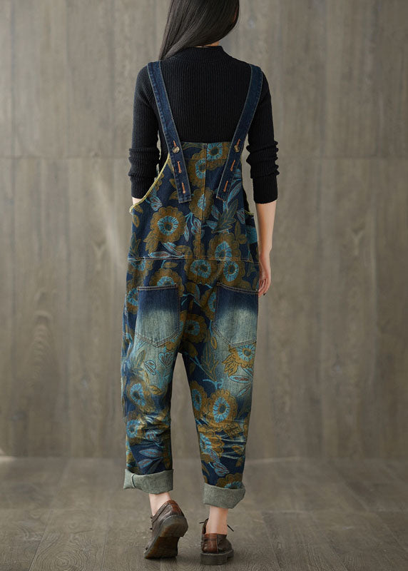 Lockerer, blauer Denim-Jumpsuit mit weitem Bein und Patchwork-Print