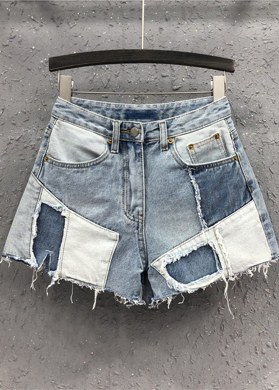 Neuartige blaue asymmetrische Patchwork-Jeansshorts mit hoher Taille