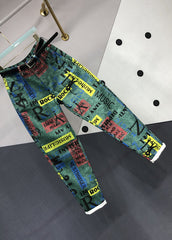 Pantalones vaqueros de patchwork con bolsillos gráficos verdes novedosos para otoño