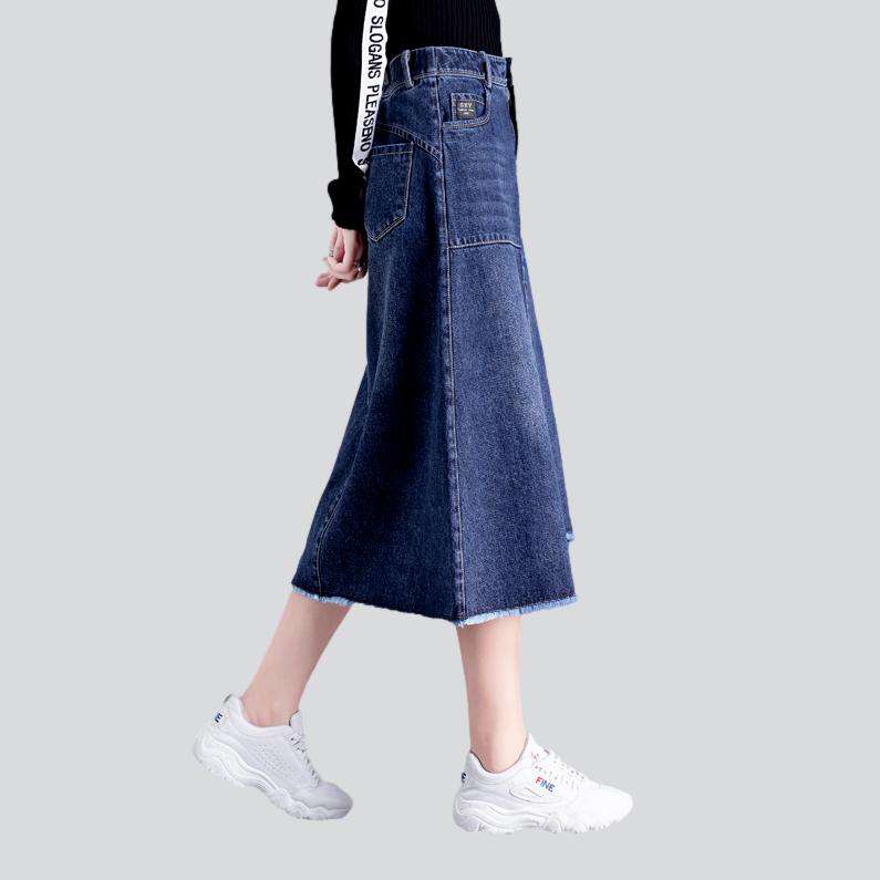 Asymmetric hem whiskered denim skirt