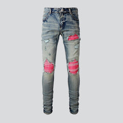 Rosa Patchwork-Jeans für Herren